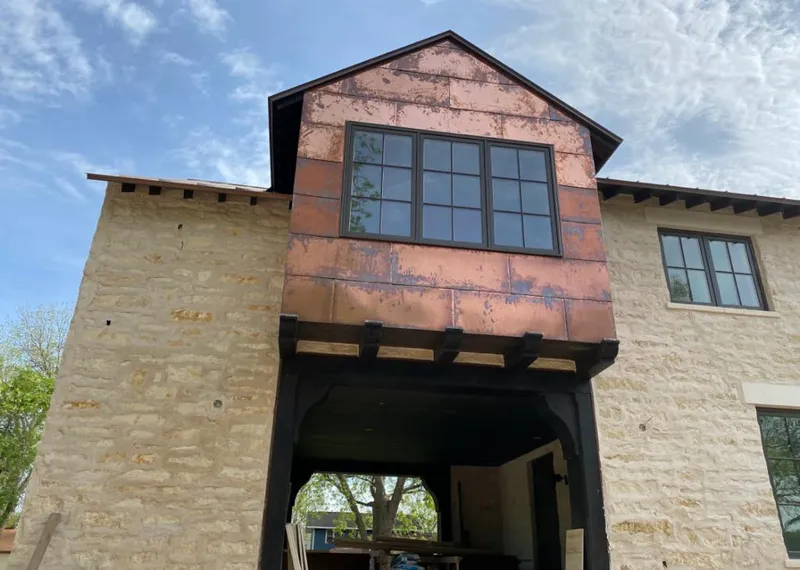Copper metal panel facade on a stone building for Skylight Installation in Florham Park